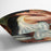 Woman with hair combs by Renoir Cushion