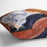 Young woman reads illustrated journal by Renoir Cushion