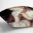Young woman strokes her hair by Renoir Cushion