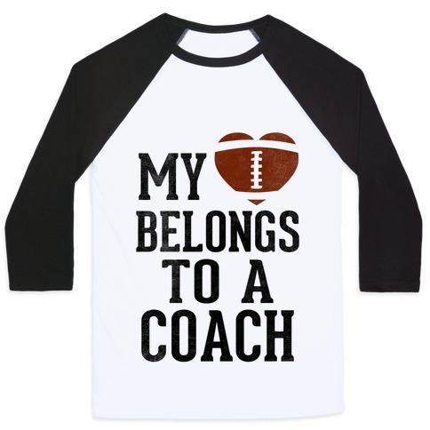 Virgin Teez  Baseball Tee Unisex Classic Baseball Tee / x-small / White/Black MY HEART BELONGS TO A FOOTBALL COACH (BASEBALL TEE) UNISEX CLASSIC BASEBALL TEE