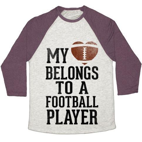 Virgin Teez  Baseball Tee Unisex Tri-Blend Baseball Tee / small / Oatmeal / Maroon MY HEART BELONGS TO A FOOTBALL PLAYER (BASEBALL TEE) UNISEX TRI-BLEND BASEBALL TEE